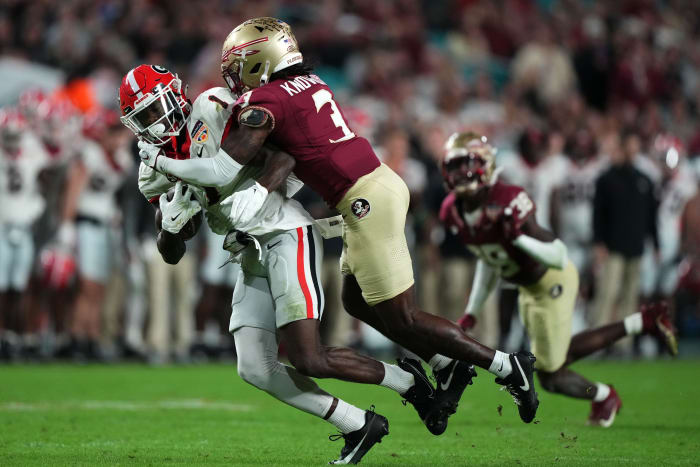 Dec 30, 2023; Miami Gardens, FL, USA; Georgia Bulldogs wide receiver Marcus Rosemy-Jacksaint (1) makes a catch against Florida State Seminoles defensive back Kevin Knowles II (3) during the second half in the 2023 Orange Bowl at Hard Rock Stadium. Mandatory Credit: Jasen Vinlove-USA TODAY Sports